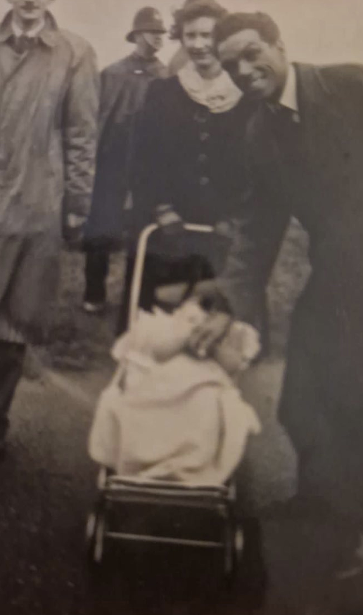 Charlie Hutchison with his wife Patricia, photographed with a pram. Late 1940s.