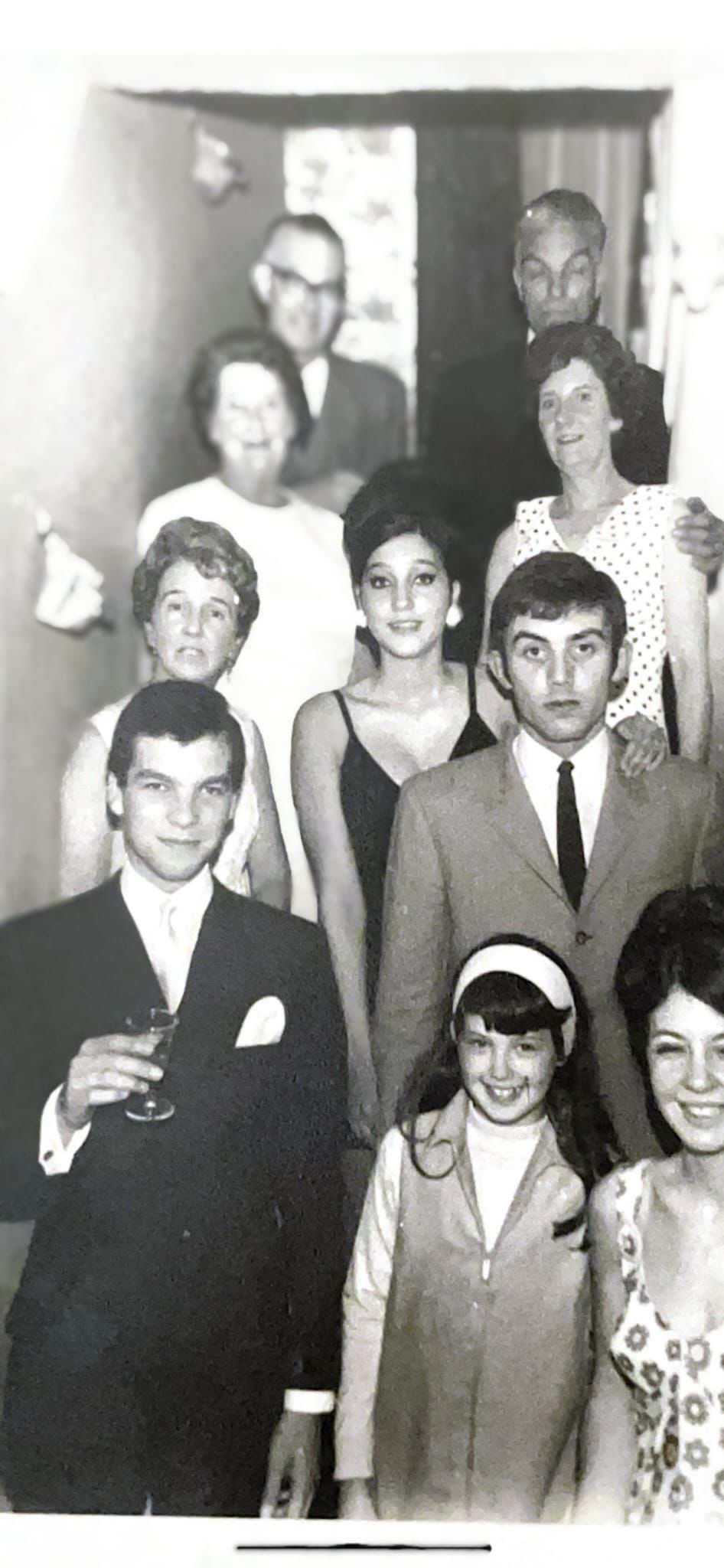 Charlie Hutchison (top right) attending an engagement party for his son John.