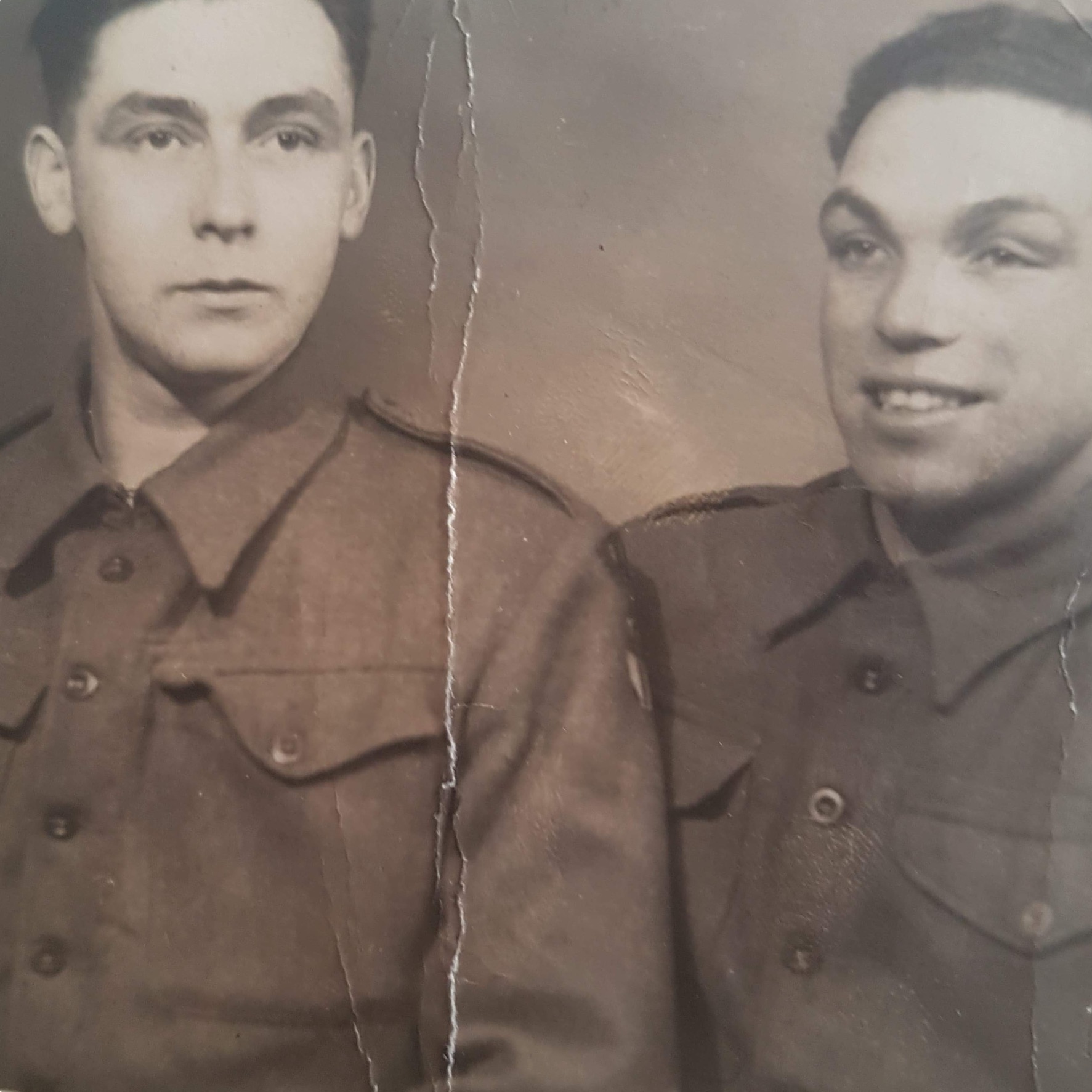 Charlie Hutchison (right) poses with an unidentified man during WWII.