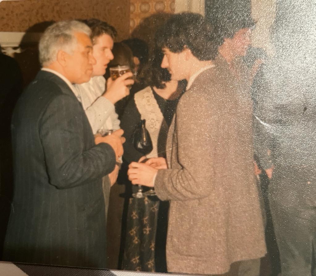 Charlie Hutchison holding a drink.