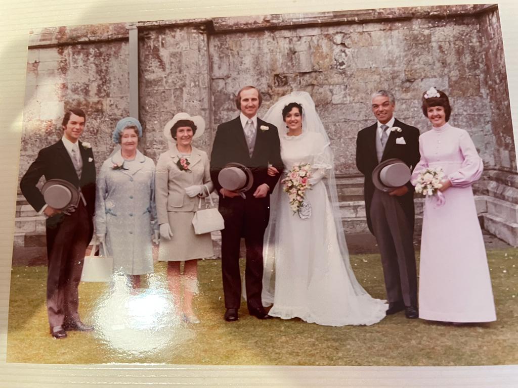 Charlie Hutchison attending his daughter's wedding, Christchurch priory, 1974.